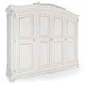 Elegant White Classical Wardrobe With Ornate Carved Details And Multiple Panel Doors