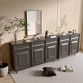 Modern Entryway Cabinet And Sideboard With Potted Plant Framed Artwork Decorative Items And Striped Rug
