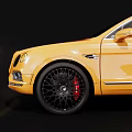 Yellow Bentley SUV with Black Wheels and Red Calipers Stylish Exterior Design on Black Background