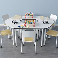 Round Table And White Chair Set With Yellow Seats Building Blocks In Kids Play Area
