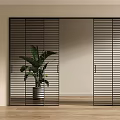 Modern Black Slatted Sliding Doors In Interior Space With Wooden Floor And Green Plant