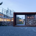 Building Exterior Wall With Stone Structure Wooden Entrance Frame Bamboo Plants And Evening Lighting