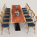 Elegant Dining Table Set With Long Wooden Top Black Base Golden Chairs And Blue Cushions