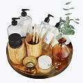 Stylish Bathroom Accessories on Gold Tray with Wooden Holders Black Pump Bottles and Green Plant