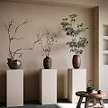 Three Decorative Vases With Bare Branches Red Blossoms Green Bamboo On White Pedestals Indoor Setting