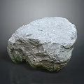 Natural Gray Stone Rock With Rough Textured Surface And Mossy Green Base