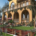 Elegant Garden Landscape With Yellow Building Arched Doors Balcony Greenery Lawn Planters And Wooden Deck