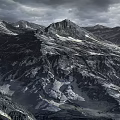 Majestic Mountain Landscape With Rocky Peaks And Snow Under Cloudy Sky