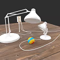 White Table Lamps Placed On Wooden Table With Colorful Striped Ball