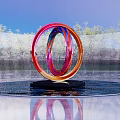 Colorful Circular Sculpture with Red Pink Blue Rings in Water with Reflection and Tree Background