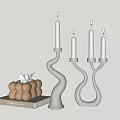 Modern Silver Curved Candle Holders With Lit Candles And Decorative Accessories