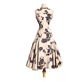 Beige Sleeveless Dress With Dark Floral Patterns And Fitted Waist Flared Skirt On Mannequin