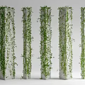 Green Vines Covering Five White Vertical Pillars With Lush Foliage