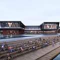 Modern Waterfront Building With Glass Facade Red Brick Accents Tiered Plaza People Relaxing Wooden Walkway