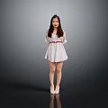 Woman with long hair standing in gray background wearing white dress and high heels