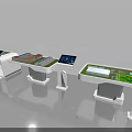 Interactive Sand Table Display With Digital Screens On White Stands And Green Surfaces 3d model