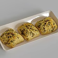 Three Golden Brown Square Shaped Pastries with Pumpkin Seeds on White Rectangular Plate 3d model