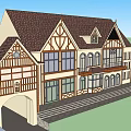 Tudor Style Office Building With Brown Roof Large Windows Arched Doors And Balcony