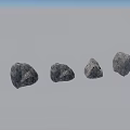 Four Natural Textured Stones With Different Shapes On Gray Surface