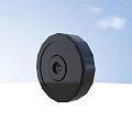 Black Circular Tire With Central Hub Against Blue Sky And White Ground