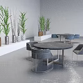Modern Gray Lounge Chairs With Round Tables Green Plants And White Shelves In Indoor Setting