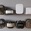 Various Style Kitchen Appliances Including Black White Silver Rice Cookers And Pressure Cookers