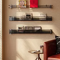 Wall mounted Bookshelf With Metal Brackets And Decorative Books Artworks In Modern Living Room Sunlight
