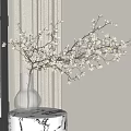 White Blossom Branches In Transparent Vase On Marble Table By Window With Snowy View