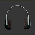 Modern Computer Headphones With Silver Headband Green Earcups And Brown Padded Cushions