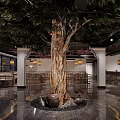 Restaurant Interior Featuring Central Large Tree Decorative Stone Basin And Wooden Furniture