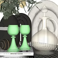 Elegant Green Wine Glasses And Golden Decanter In Stylish Table Setting With Books Floral Vase