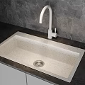 Speckled Beige Kitchen Sink With White Faucet And Dark Countertop Modern Design