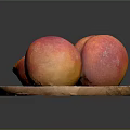 Fresh Peaches on a Wooden Plate One Halved with Juicy Red Flesh and Pit