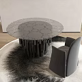 Modern Round Table And Gray Chair With Circular Pattern Top Black Legs On Wooden Floor