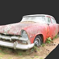 Old Rusted Red Car Left Abandoned In Overgrown Grass And Dirt