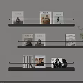 Black Wall Mounted Three Tier Display Shelves Holding Magazines On Light Wall With Green Plant