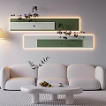 White Sofa And Round Coffee Table With Vase Fruits Cup And Green White Wall Panels