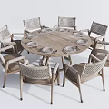 Round Wooden Dining Table Set With 8 Rattan Chairs And White Plates