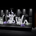 Elegant Stage Decor With White Floral Arrangements Purple Accents Grid Background Chandeliers And Lighting