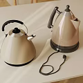 Two Stylish Cream Colored Electric Kettles With Modern Design On Kitchen Counter