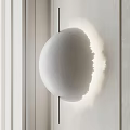 Golden Spherical Wall Light With Moon Surface Texture Mounted On White Wall 3d model