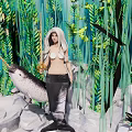Gorgeous Mermaid in Underwater Scene with Lush Aquatic Plants and Smooth Rocks