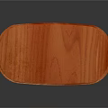Oval Orange Wooden Dining Table With Carved Legs And Smooth Surface