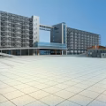 Large Modern Building Exterior With Metal Structure And Spacious Light Colored Square