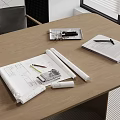 Desk With Rolled Blueprints Ruler Pencil Open Notebook And Mobile Phone