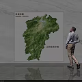 Man Viewing Green Jiangxi Province Topographic Map Wall Decor in Interior 3d model