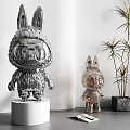 Shiny Metallic Rabbit Shaped Sculptures Large And Small On White Display Stands