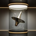 Golden Abstract Sculpture In Transparent Display Case With Gold Frame And Interior Lighting