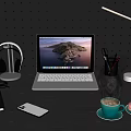 Modern Laptop On Dark Wooden Desk With Headphones Smartphone Coffee Cup Macarons And Desk Lamp