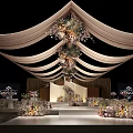 Elegant Wedding Stage Decorated With Floral Arrangements Drapes Soft Lighting And Seating